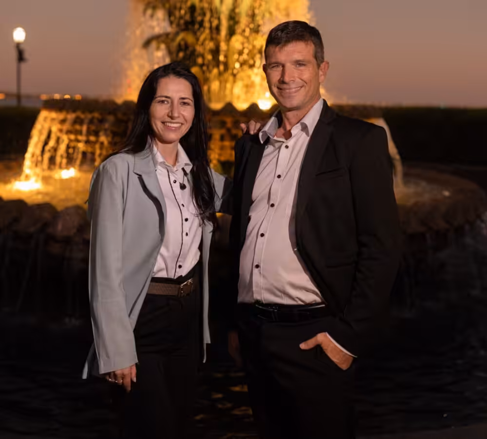Couple by illuminated fountain