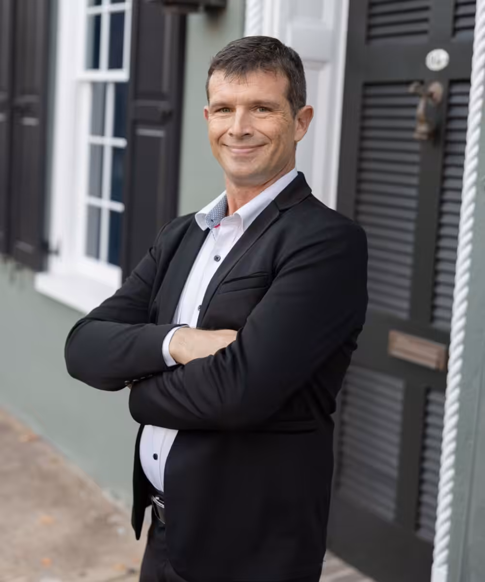 Man in suit arms crossed