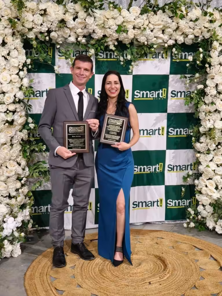 Charleston Real Estate- Investors Heaven Awards winners in floral backdrop
